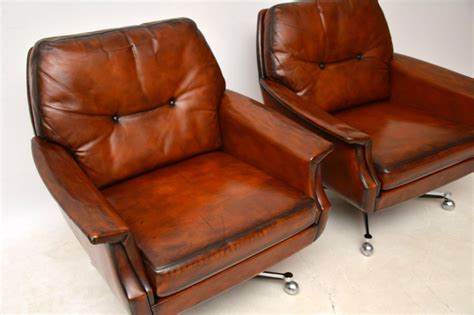 pair  vintage leather chrome swivel armchairs