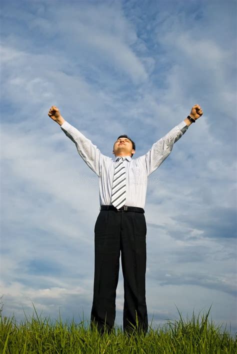 young businessman staying  victory pose royalty  stock photography image