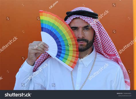 Photo De Stock Attractive Arabic Gay Man Holding Fan 1500664001
