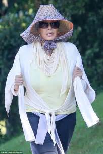raquel welch dons bee keepers style hat in los angeles