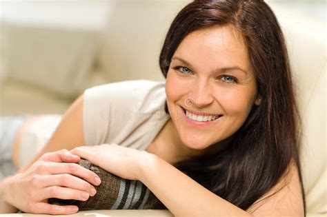 serene cheerful woman lying on couch stock image image of caucasian looking 31242549