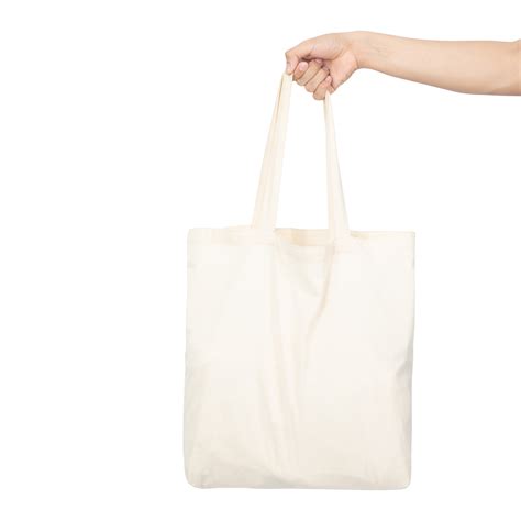 hand holding canvas tote bag mockup  png