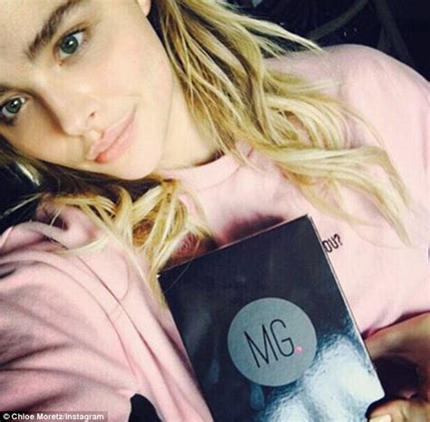 chloe moretz steps out in kanye west s yeezys amid twitter row with kim
