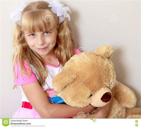 girl with a teddy bear stock image image of happiness 75251001