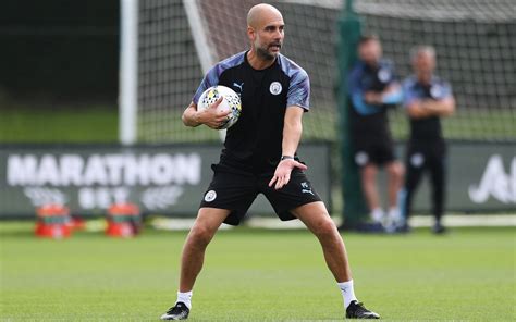 years  guardiola  man city boss extends contract