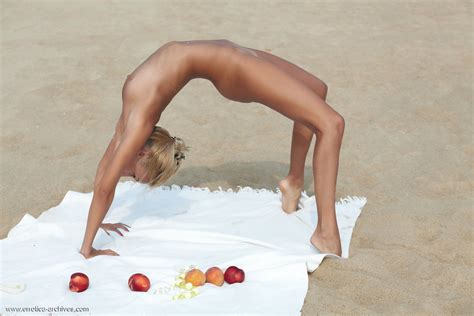 flexible blonde afina meditating naked and stretching on the beach