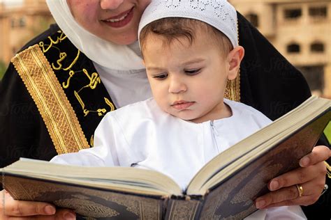 Mother Teaches Son To Read Quran On Eid By Stocksy Contributor Imman