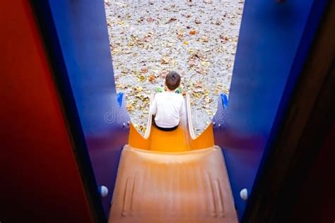 child sliding   sliding board stock photo image  play parenthood