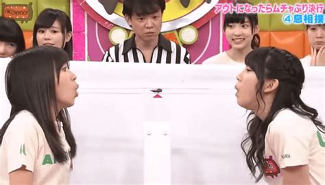 Crazy Japanese Game Show Sees Two Girls Trying To Blow A Cockroach Into