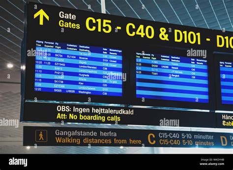 flight information arrival departure board showing destinations time  status