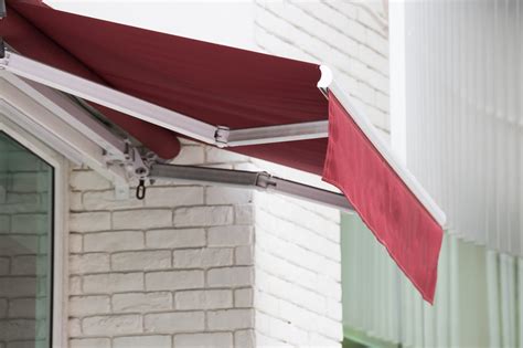 retractable awning costs    mechanical  motorized awnings