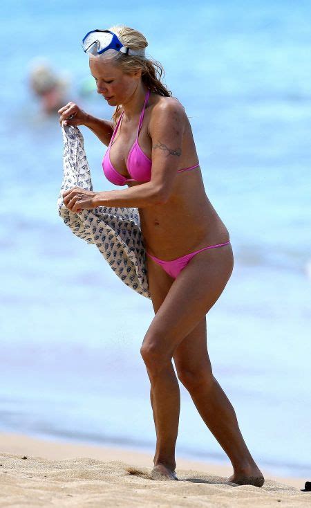 retro bikini pamela anderson makes waves in a “pink bikini as she goes snorkelling in hawaii
