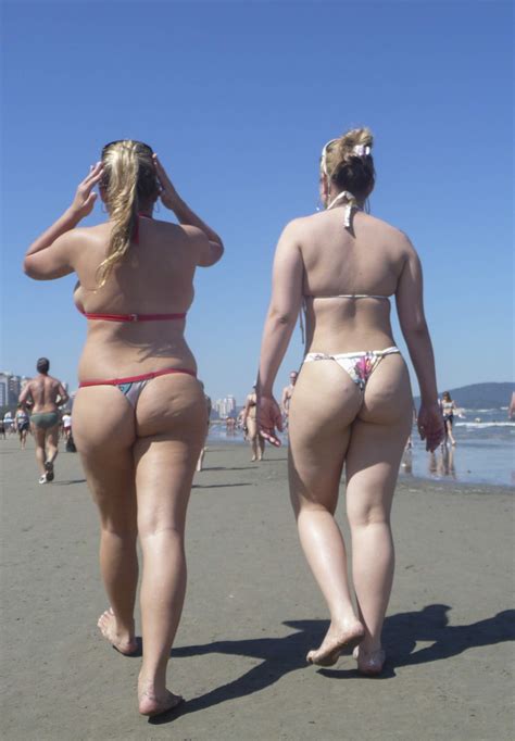 vio 0177 blonde teen duo pale one and chubby one showing their thongs on the beach