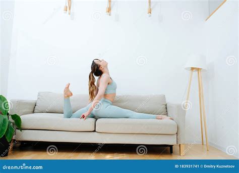 She Drop Into The Splits On The Couch Doing Daily Stretching Stock