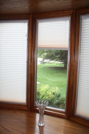pella bow wood window  raise   pleated shades custom view windows