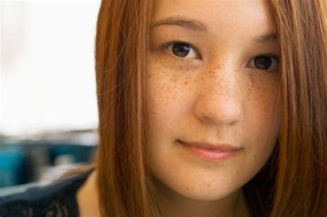 a freckled redhead of east asian ethnicity beautiful faces