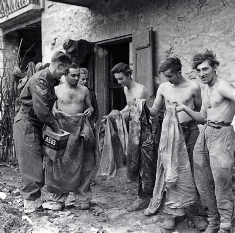 german prisoners of war being deloused before interrogation castel del