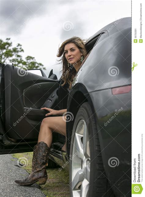 Woman In Boots Getting Out Of Car Stock Image Image