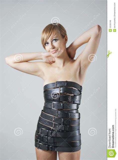 model wearing dress made from leather belts royalty free