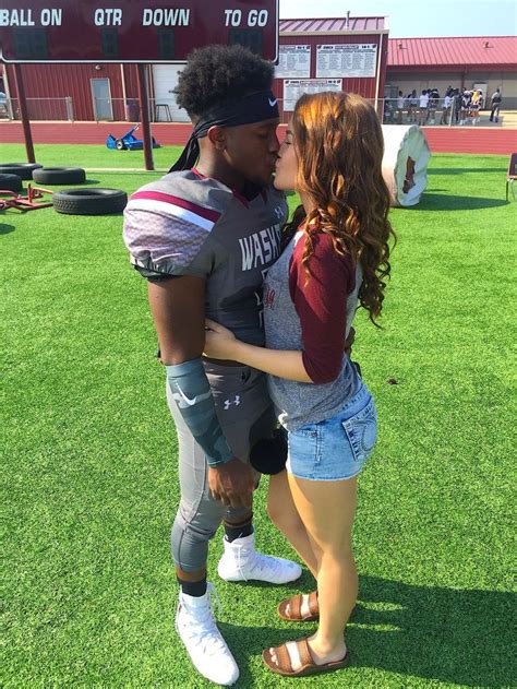 a kiss before the game football couples football