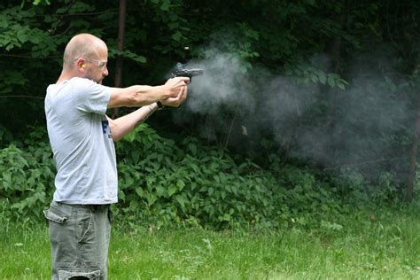 man shooting  gun stock photo freeimagescom