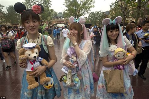 ecstatic fans finally get inside shanghai disney as the theme park opens its doors to the public