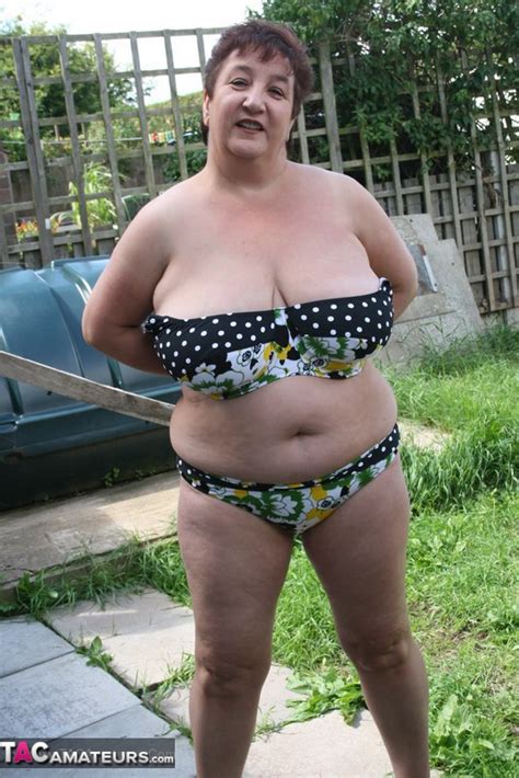 luscious granny pose her plus size body outdoor before she strips off her black and white polka