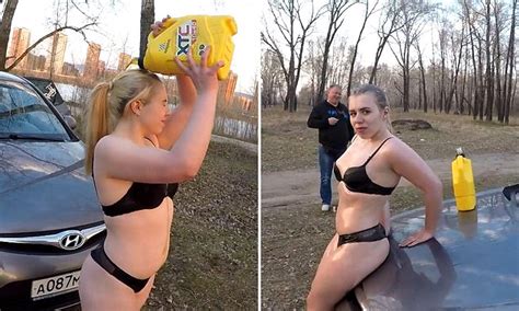 russian girl in her underwear pours oil over herself for a