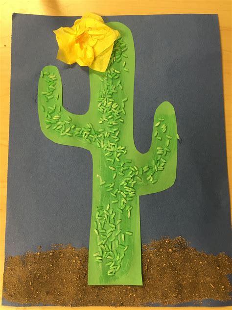 paper cactus  yellow flower sitting  top   green planter