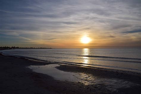 picture ocean beach sea shoreline water sunset sun seaside