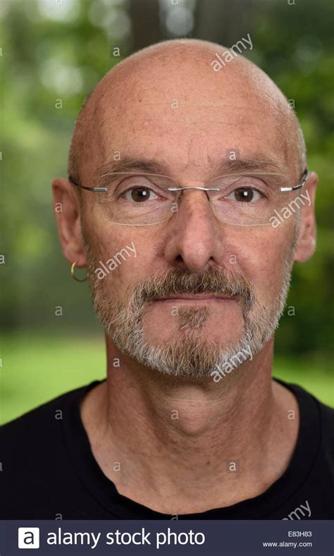 Face Of Retired Bald Man About 60 Years Old With Beard And