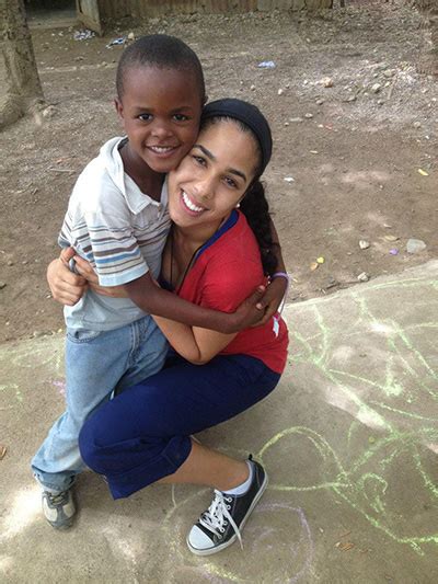 Amor En Accion Missionary Janelle Jay Gets A Big Hug From A New Friend