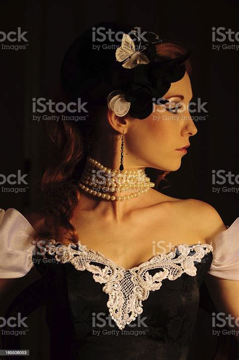 Vintage Victorian Glamour Redhead Lady Sitting In Dress With Hat Stock