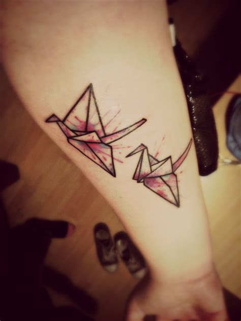 origami crane tattoo  splattered colour effect swan tattoo ink