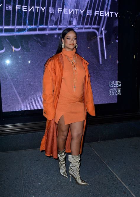 Rihanna Braless In Short Orange Dress
