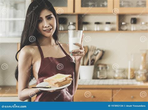 Seductive Girlfriend Wearing Only Apron Is Preparing Breakfast For Her