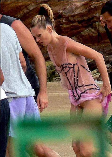 kate moss picking up her skirt reveals yet another knicker less shot on