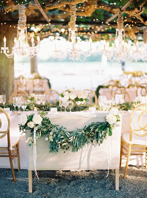 tables  set  white flowers  greenery   elegant