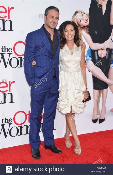 taylor kinney and mom at thethe other woman premiere at the westwood village theatre in los