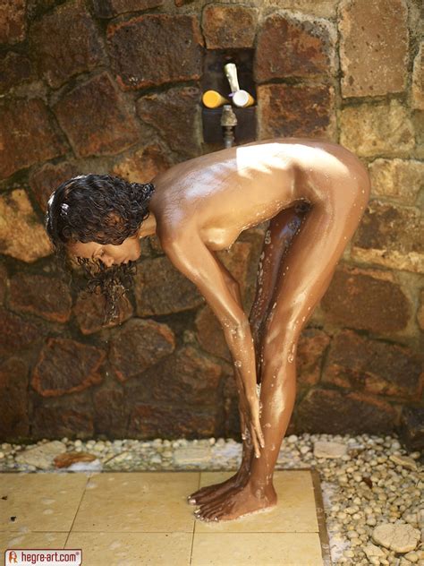 nude ebony teenie girl takes a outdoor shower