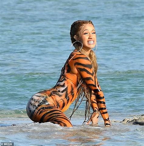 cardi b twerks on beach in tiger costume instead of attending court hearing daily mail online