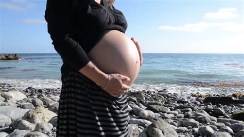 Pregnant Woman Rubbing Her Belly On Stock Footage Video 100 Royalty