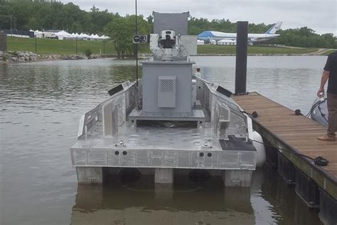 war news updates  navy unveils  unmanned boat    caliber machine gun