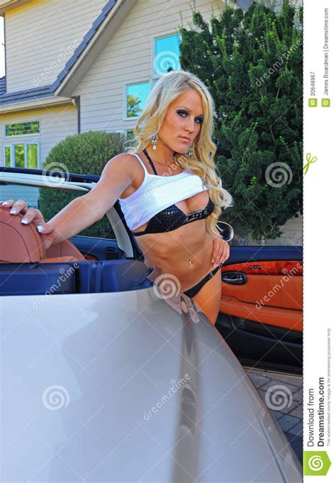 Sexy Woman Getting Out Of A Car Royalty Free Stock