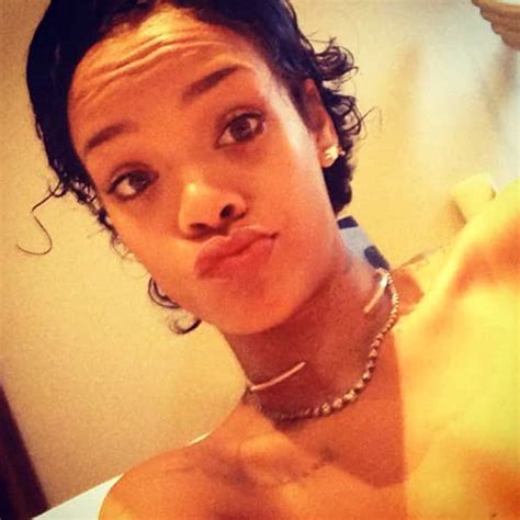 Rihanna Debuts Natural Hair Taunts Chris Brown On