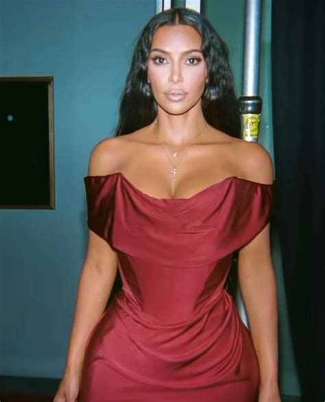 kim kardashian serves looks in sexy pictures in an off shoulder satin
