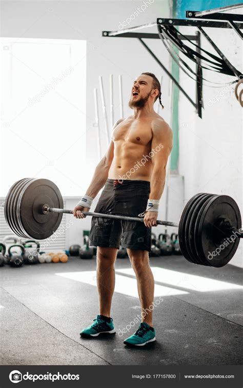 man lifting weights muscular man workout  gym  exercises