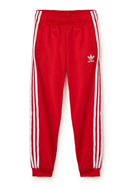 adidas superstar tapered fit track pants met logo rood de bijenkorf adidas superster
