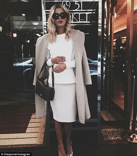 cheyenne tozzi oozes sophistication in white pencil skirt grey overcoat and large sunglasses