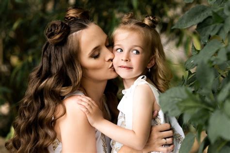 Premium Photo Happy Woman Mom Plays With Her Daughter Outside In